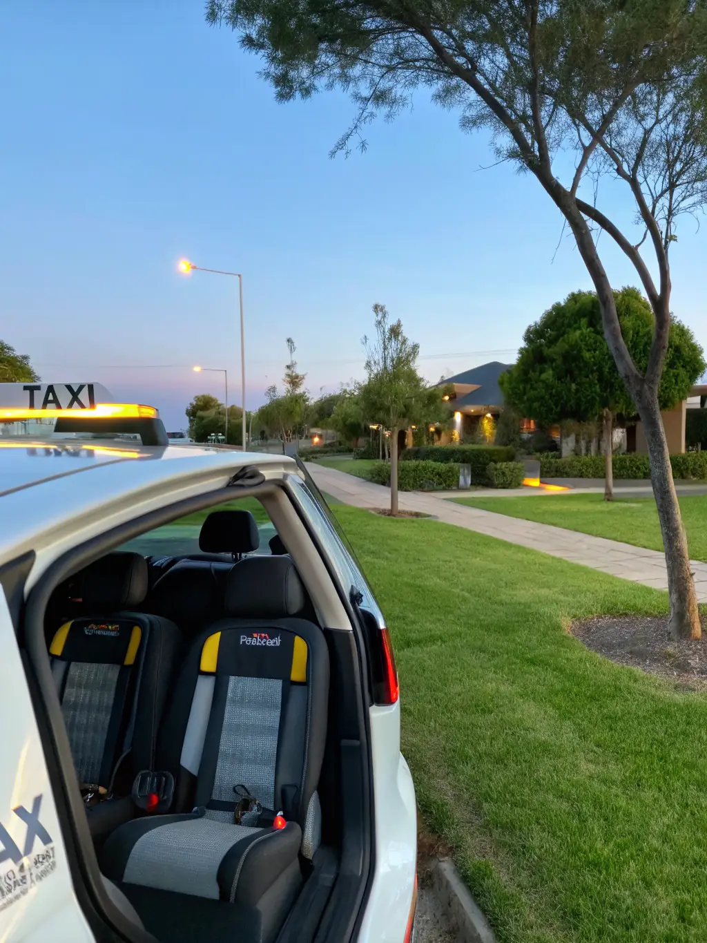 A modern taxi with a child safety seat installed, parked in a residential area of Créteil, emphasizing Accredited Taxi Créteil's commitment to family-friendly services.