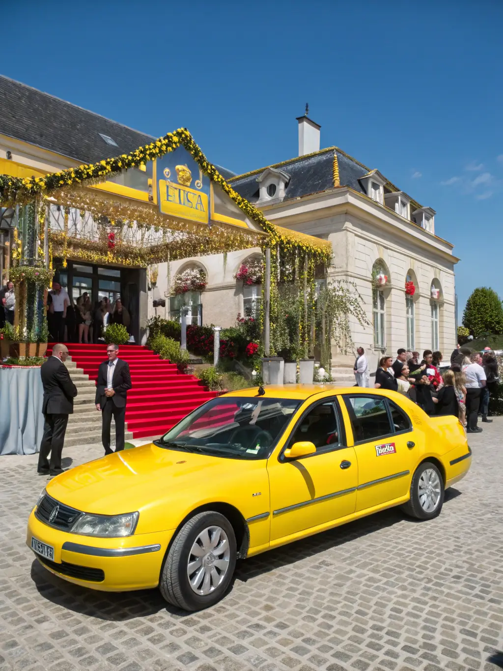 A modern, clean taxi cab parked in front of the Henri Mondor hospital in Créteil, with a clear 'conventionné' sticker displayed.